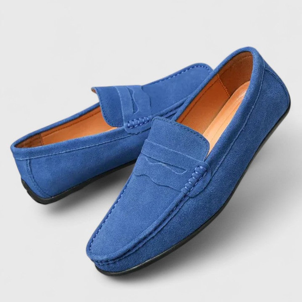 Men's blue penny loafers with moc toe stitching