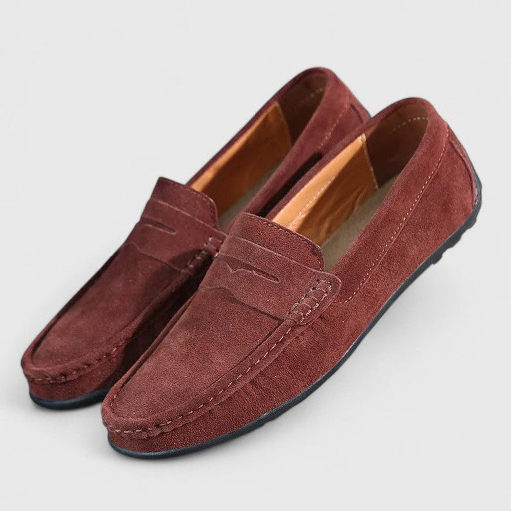 Men's blue penny loafers with moc toe stitching
