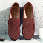 Men's penny loafers with moc toe stitching and flat soles