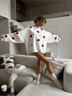 Women's knitted jumper with scattered contrasting motifs