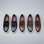Embossed slip-on loafers with gold bit detail and flat contrasting soles