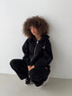 Women's black zip-up hoodie with hood, pink logo and front pouch pocket