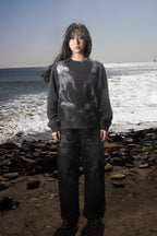 Dark graphic sweatshirt with contrasting front figure design