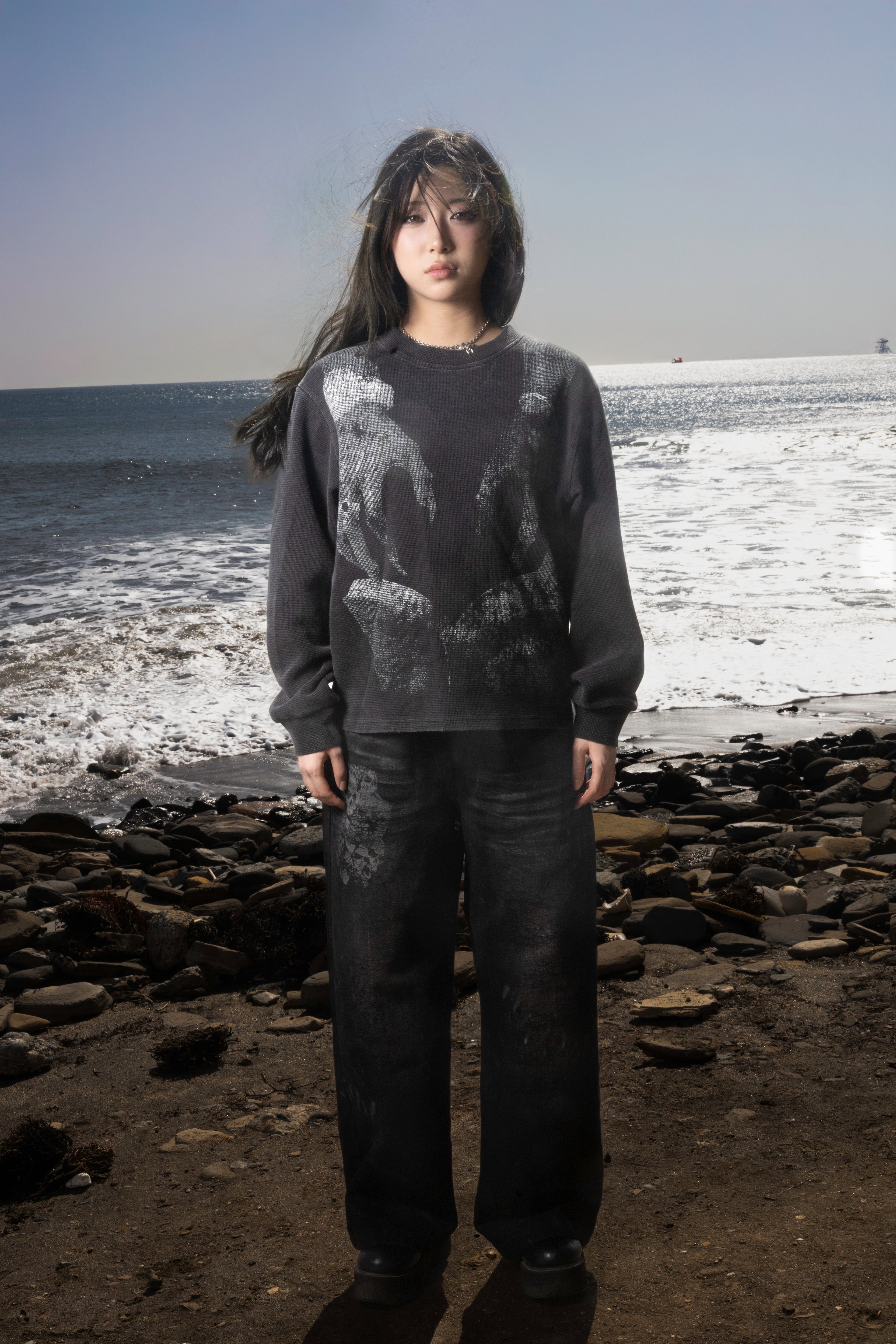 Dark graphic sweatshirt with contrasting front figure design