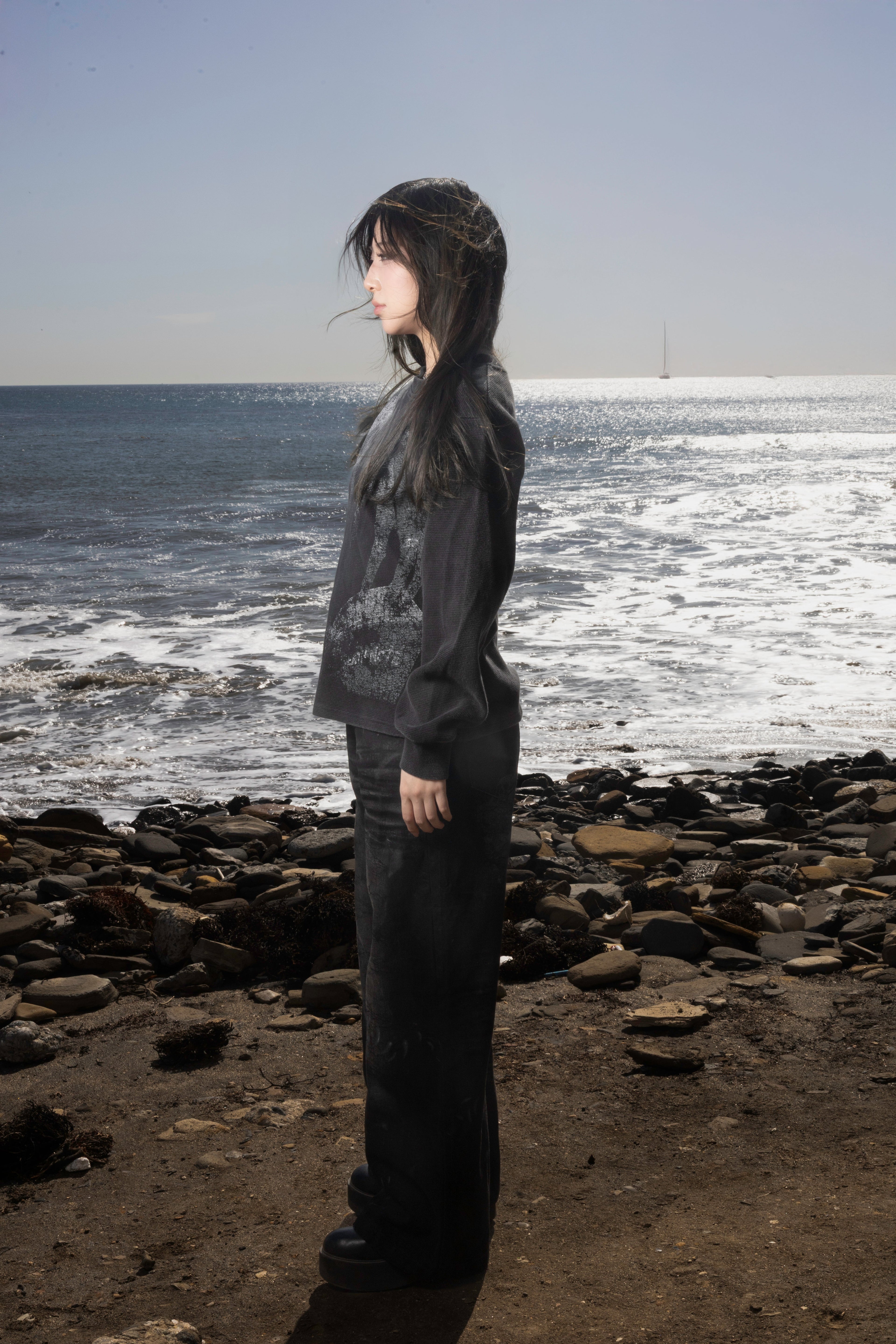Dark graphic sweatshirt with contrasting front figure design