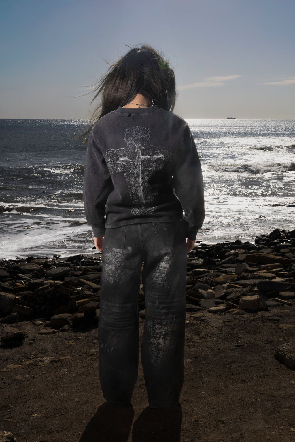Dark graphic sweatshirt with contrasting front figure design