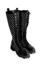 Women's black knee-high lace-up boots with silver studs and lugged soles