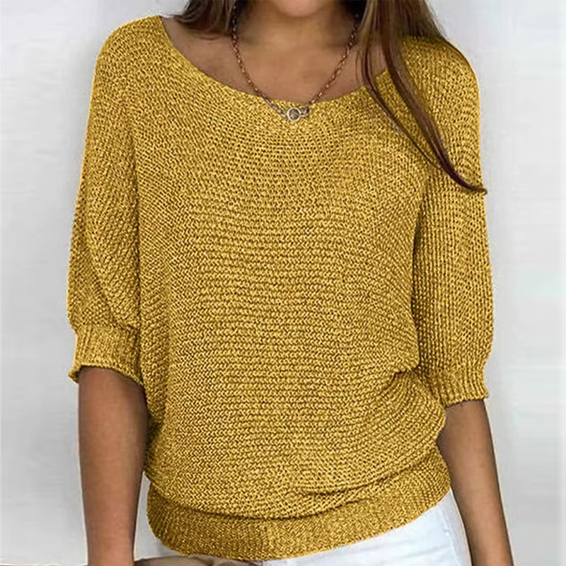 Women's textured knit sweater with round neck and three quarter sleeves