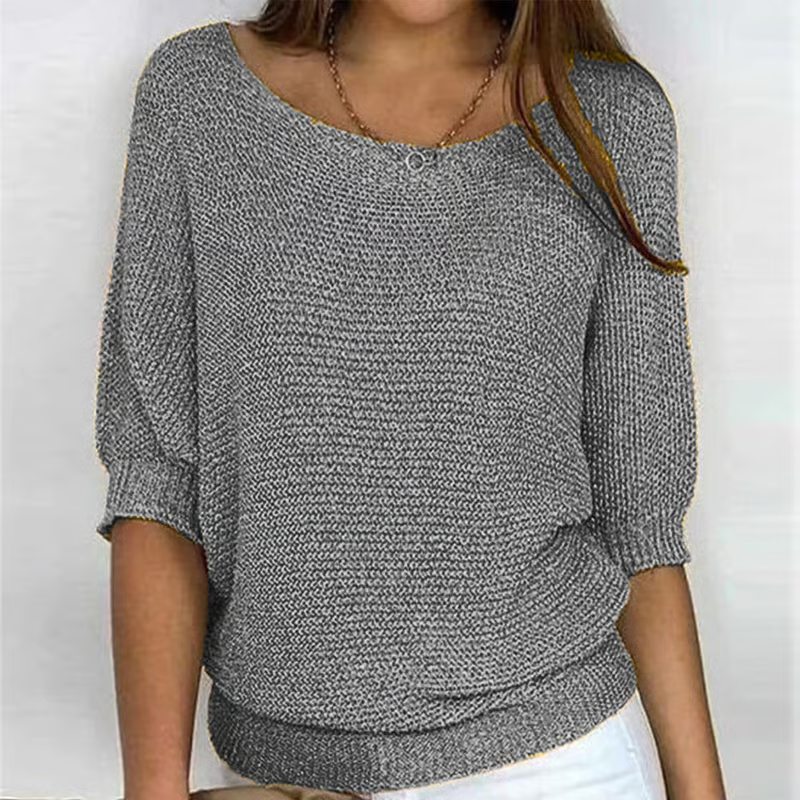 Women's textured knit sweater with round neck and three quarter sleeves