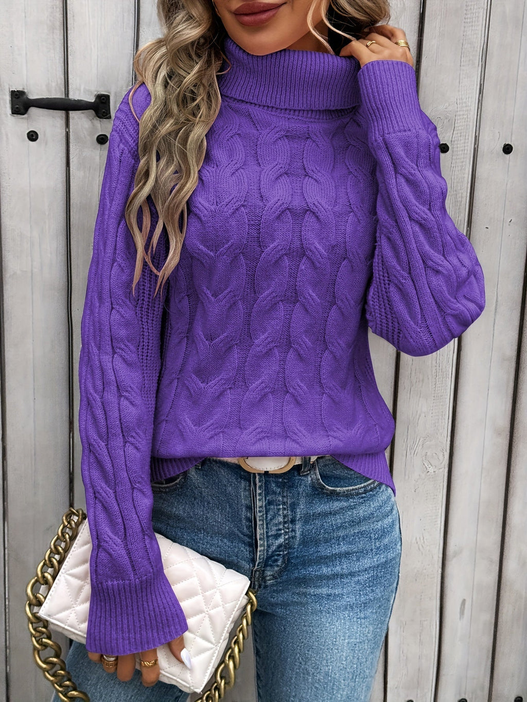 Women's cable knit turtleneck sweater with long sleeves