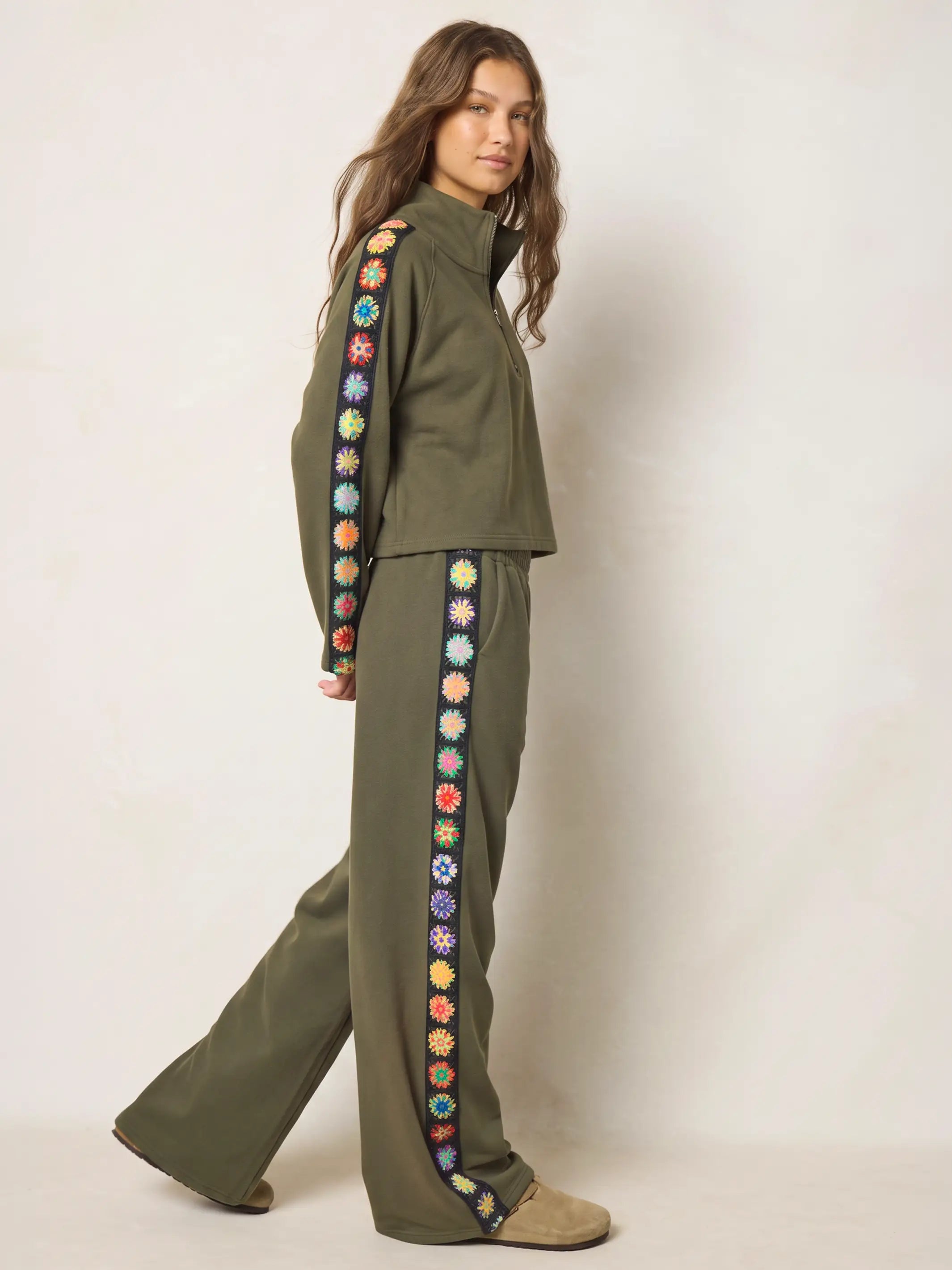 Women's olive half zip sweatshirt with floral sleeve panels