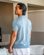 Men's short-sleeved textured knit polo shirt with contrast collar trim and button placket