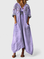 Women's boho print maxi dress in orange with front pockets, V-neck and three-quarter sleeves