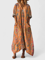 Women's boho print maxi dress in orange with front pockets, V-neck and three-quarter sleeves