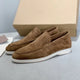 Men's slip-on loafers with textured uppers, moc toe stitching and white flat soles