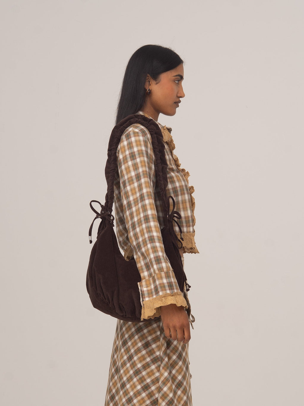 Women's brown checked cropped shirt with collar, buttons and ruffle trim