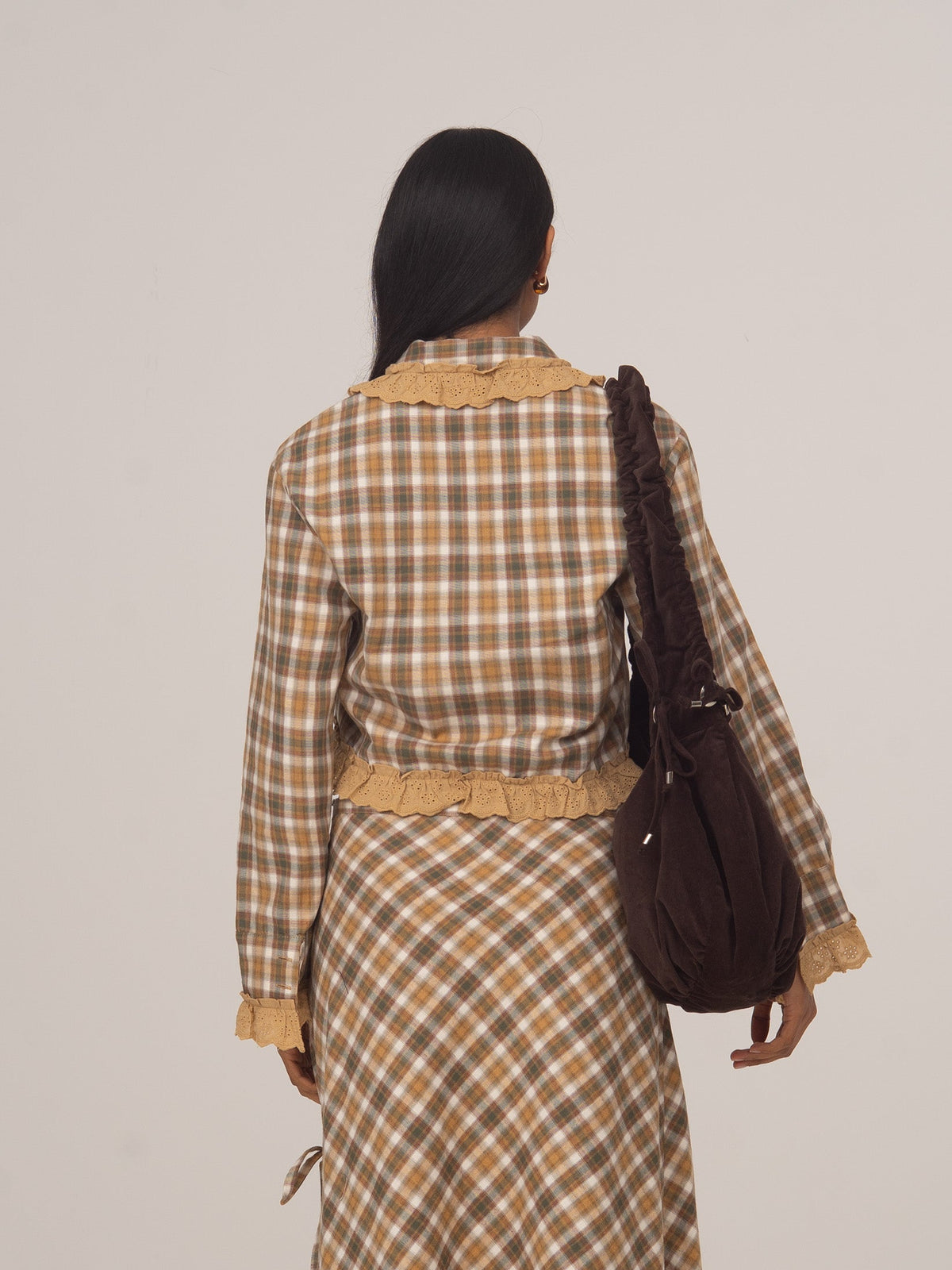 Women's brown checked cropped shirt with collar, buttons and ruffle trim