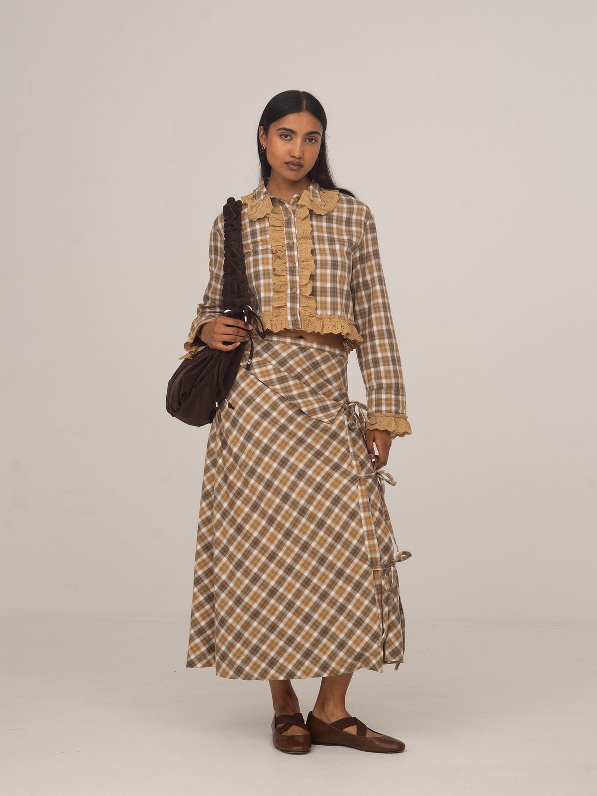Women's brown checked cropped shirt with collar, buttons and ruffle trim
