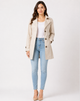 Women's short trench coat with lapels, buttons and cuff straps