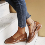 Women's perforated Mary Jane flats with triangular cutouts and an instep strap