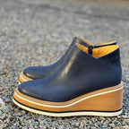 Women's ankle wedge boots with side zipper and layered platform sole