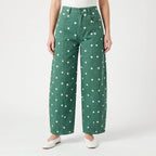 Women's high waist barrel leg jeans with an all-over polka dot pattern