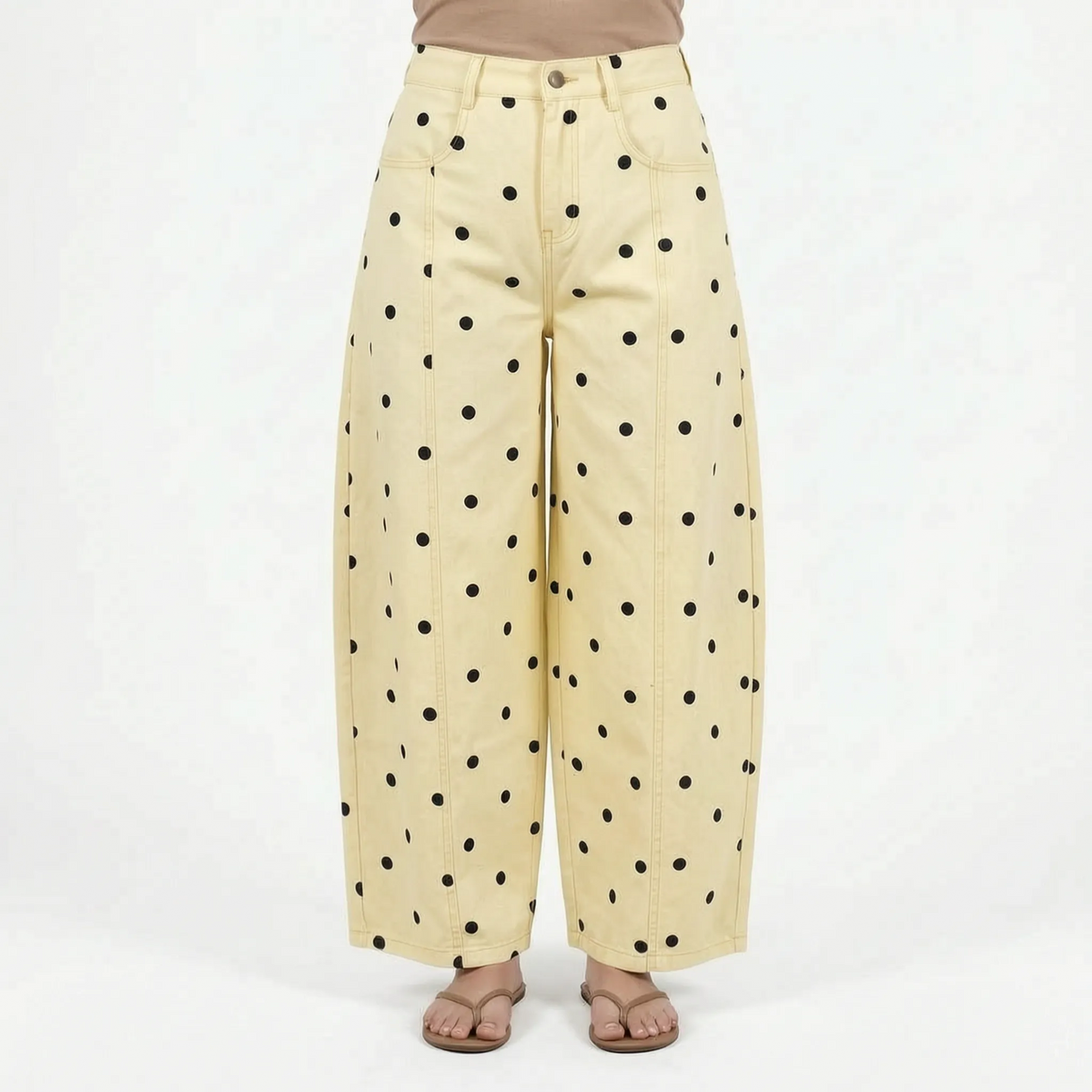 Women's high waist barrel leg jeans with an all-over polka dot pattern