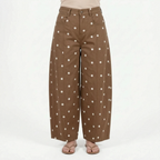 Women's high waist barrel leg jeans with an all-over polka dot pattern