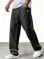 Men's relaxed wide-leg trousers with textured finish