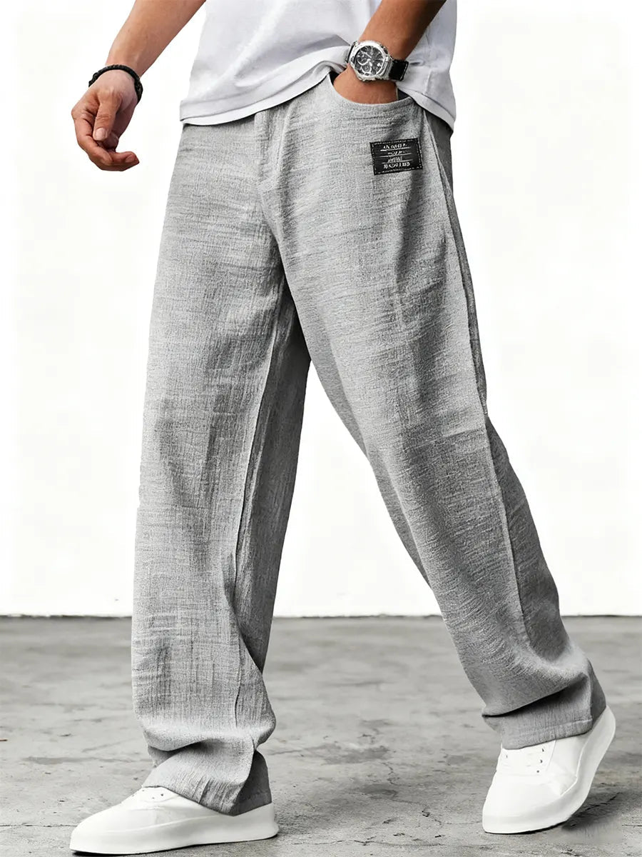 Men's relaxed wide-leg trousers with textured finish