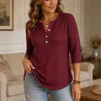 Women's waffle-textured Henley top with round neckline, button placket and three-quarter sleeves