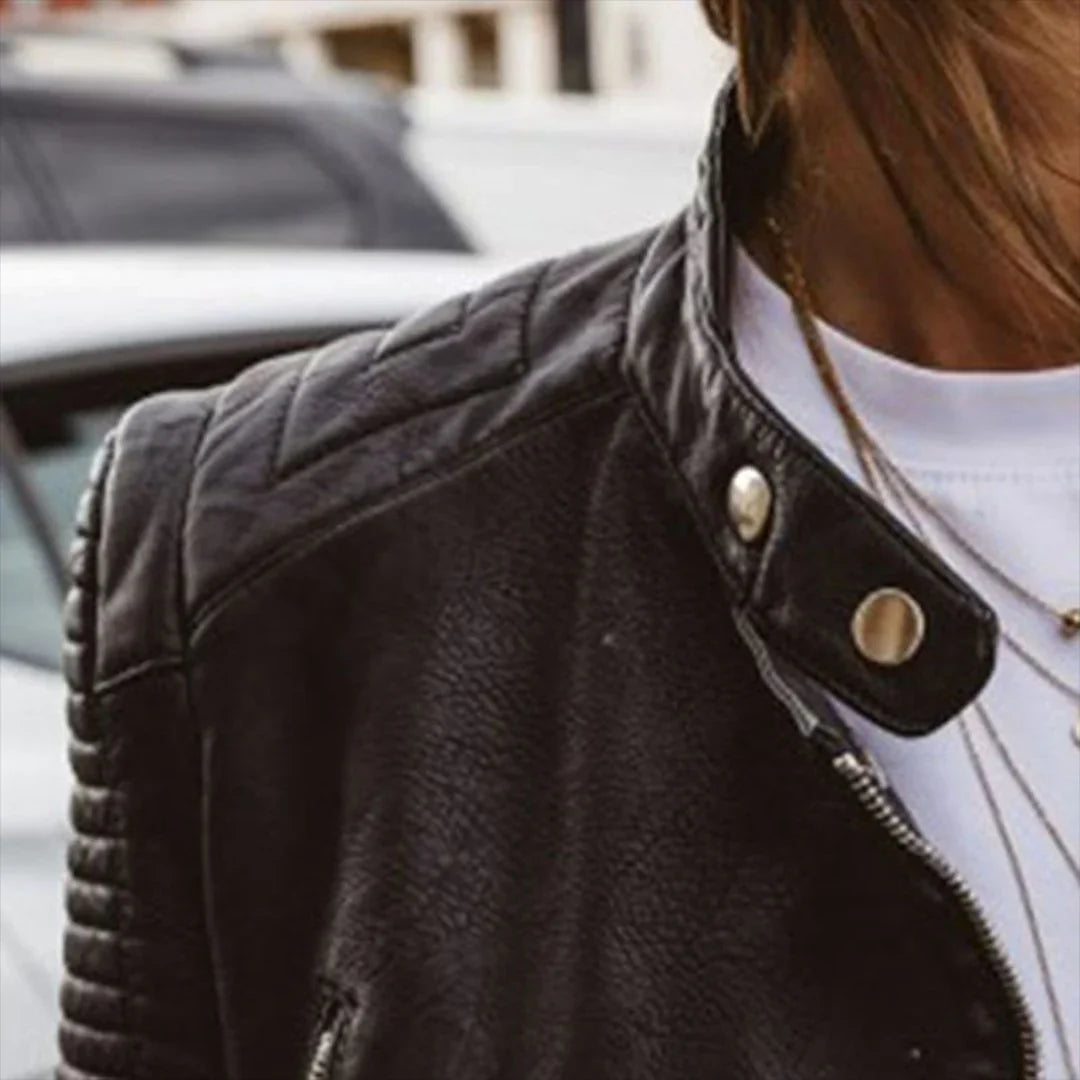 Women's black fitted biker jacket with quilted sleeves and diagonal zip
