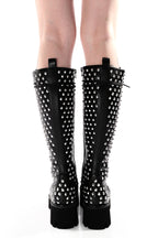 Women's black knee-high lace-up boots with silver studs and lugged soles