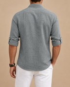 Men's long-sleeved textured polo shirt with button placket and roll-up sleeve tabs