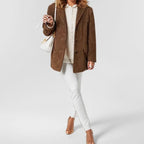 Women's blazer jacket with notched lapels, long sleeves and flap pockets