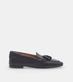 Women's black slip-on loafers with tassel detailing and flat heels