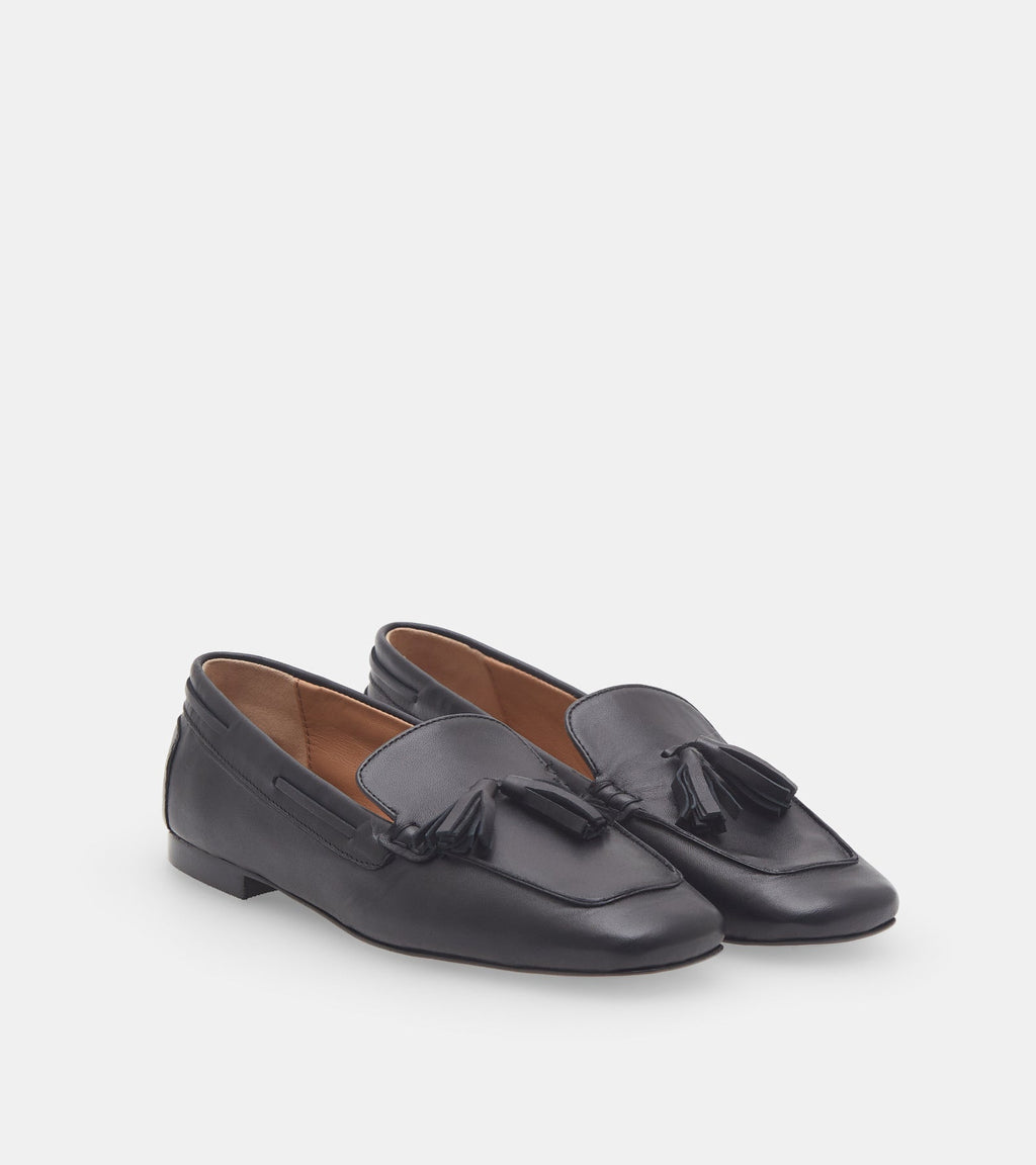 Women's black slip-on loafers with tassel detailing and flat heels