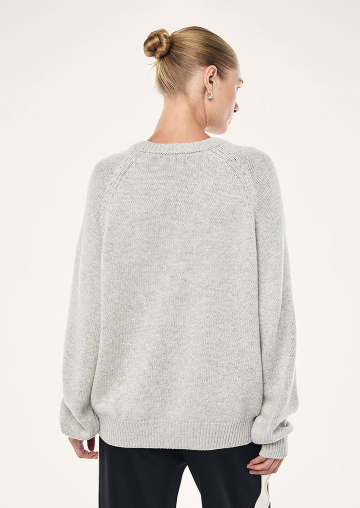Grey marle crew neck knit sweater with dark chest text