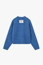 Women's blue crew-neck knit sweater with chest emblem