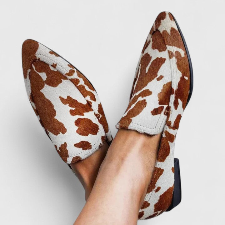Women's brown and white cow print pointed-toe loafers