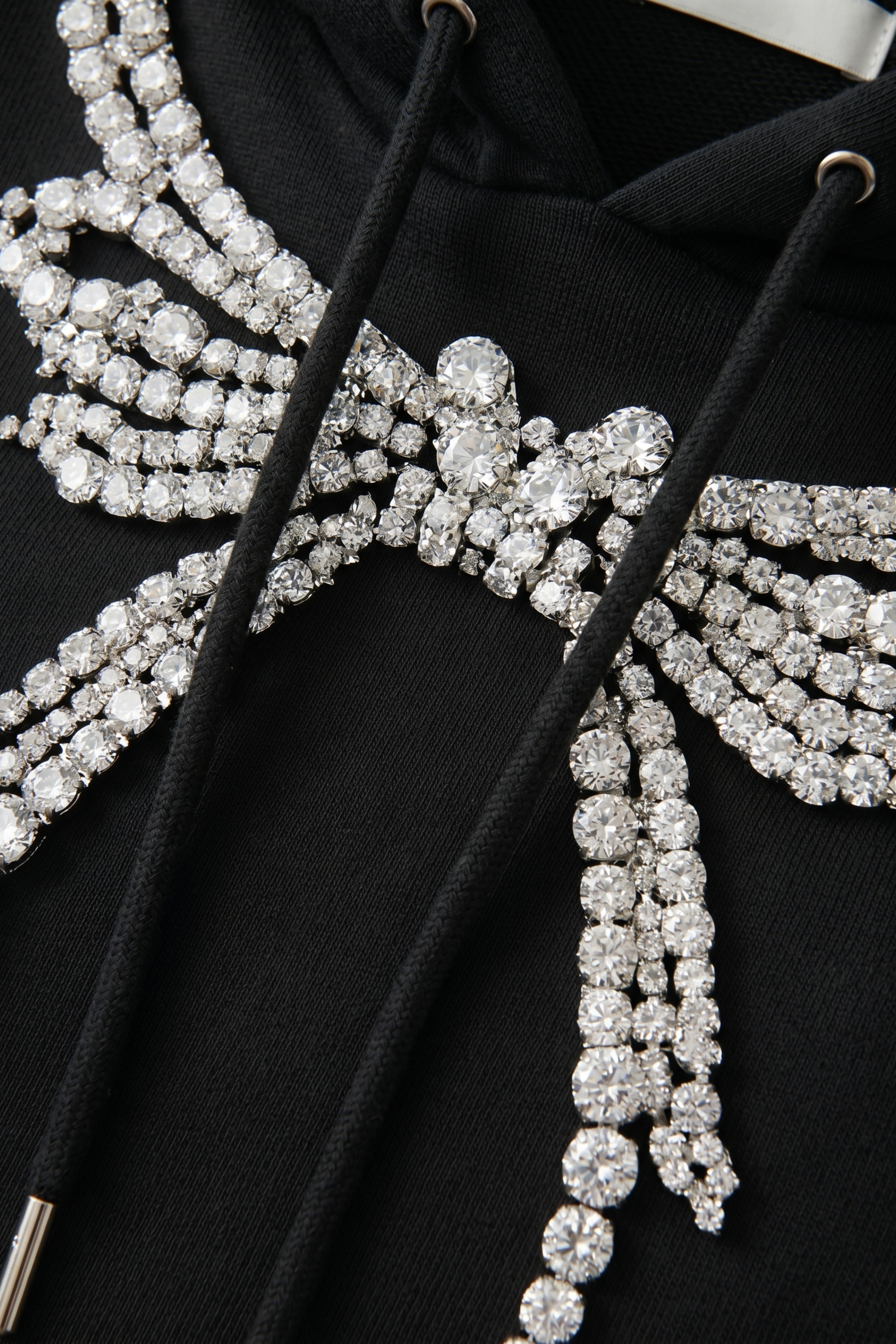 Black embellished hoodie with drawstring hood and wing motif