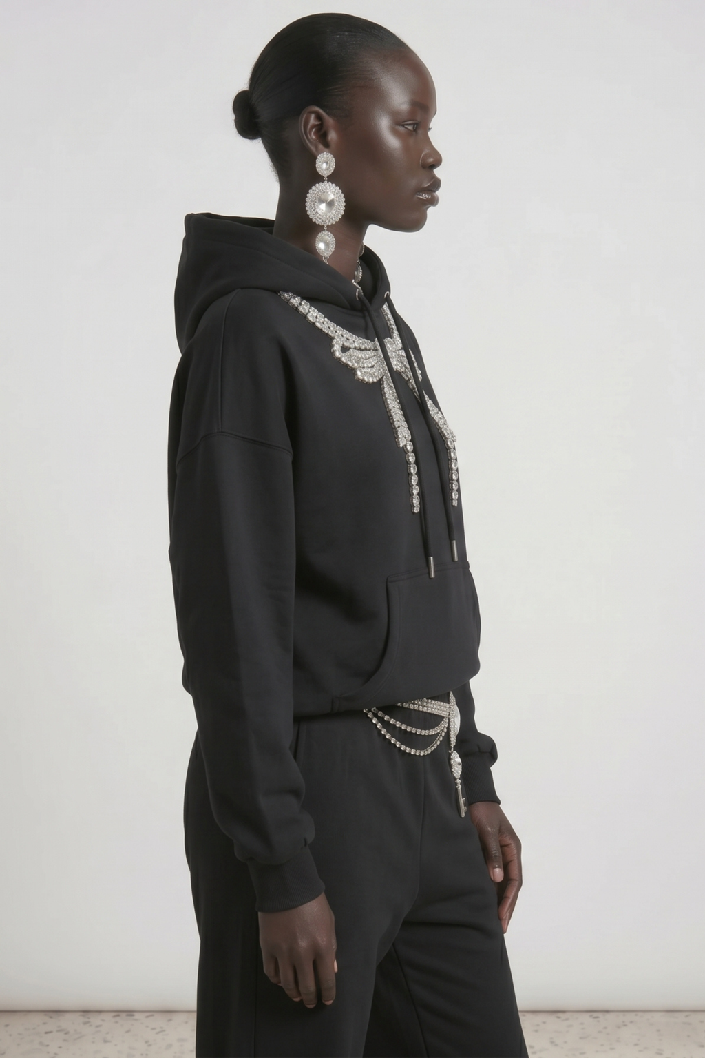 Black embellished hoodie with drawstring hood and wing motif