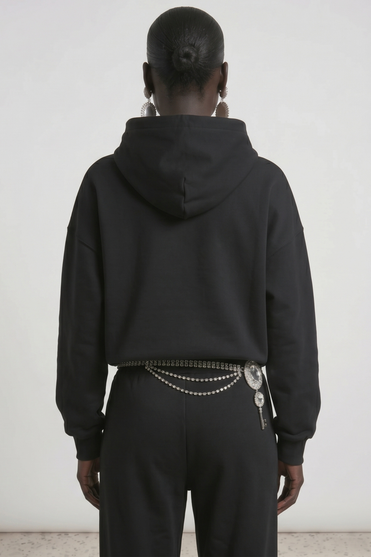 Black embellished hoodie with drawstring hood and wing motif