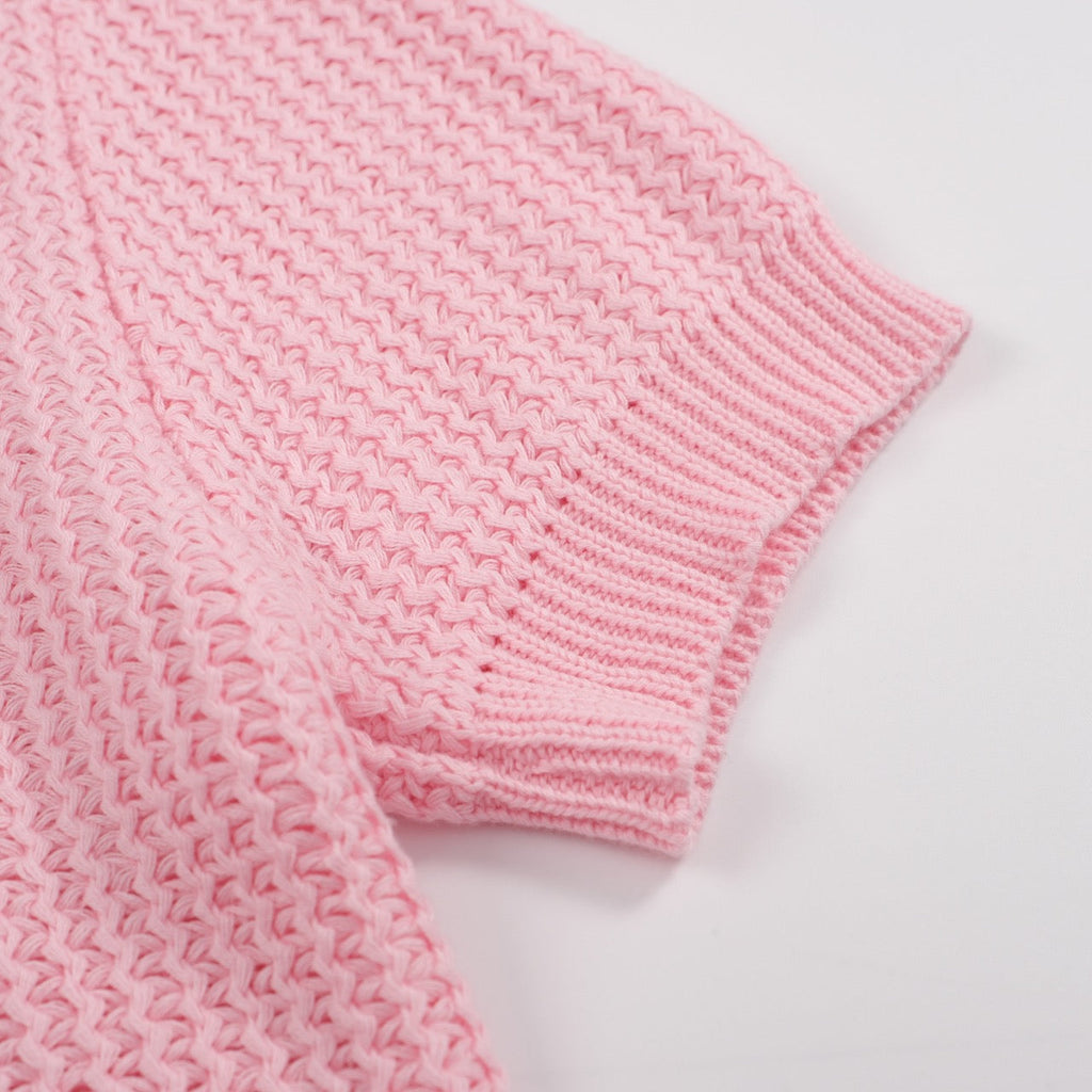 Men's pink waffle knit polo with V-neck collar