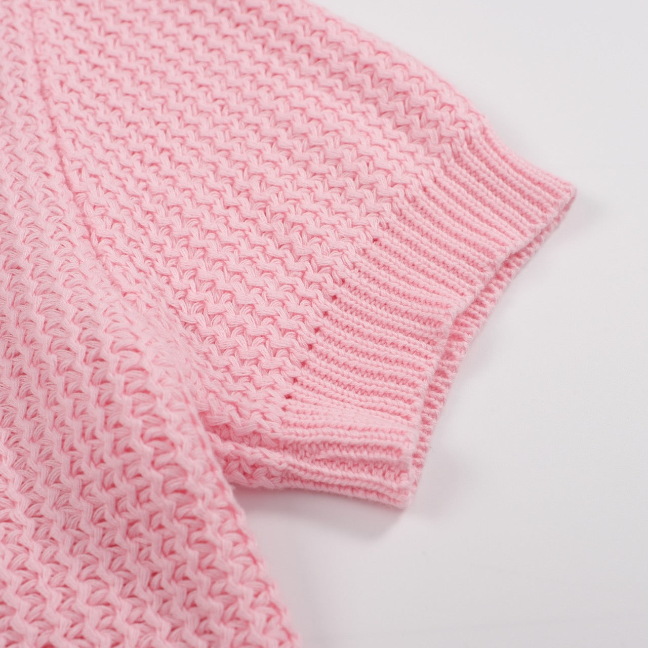 Men's pink waffle knit polo with V-neck collar