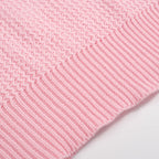 Men's pink waffle knit polo with V-neck collar