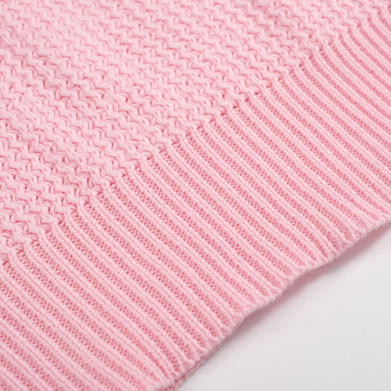 Men's pink waffle knit polo with V-neck collar