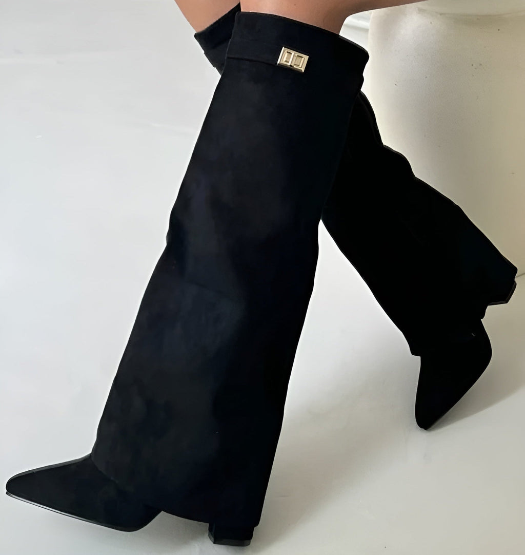 Women's black pointed toe knee-high boots with buckle detail