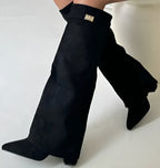 Women's black pointed toe knee-high boots with buckle detail