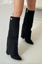 Women's black pointed toe knee-high boots with buckle detail